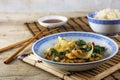 Asian vegetable dish with rice and soy sauce on a bamboo mat an Royalty Free Stock Photo