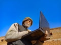 Asian village old man learning about laptop technology at rural area in india January 2020