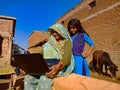 Asian village woman learning about laptop technology at rural area in india January 2020