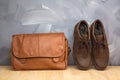 Asian vintage style men clothing and jeans and bag put on wooden table