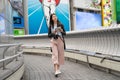 Asian visitor walking on the bridge in Dontonbori. Royalty Free Stock Photo