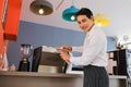 asia waiter served and serving coffee in cafe or restaurant