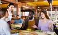 Asian waitress brought tray with restaurant guests Royalty Free Stock Photo