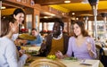 Asian waitress brought tray with restaurant guests Royalty Free Stock Photo