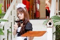 Asian waitress with wine glass concept