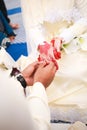 An asian wedding ceremony, the groom give the diamond wedding ring to the bride. Royalty Free Stock Photo