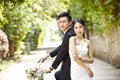 Asian wedding couple riding bicycle Royalty Free Stock Photo