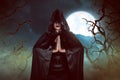 Asian witch woman casting spell in the night Royalty Free Stock Photo