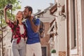 Asian woman and african american man taking selfie on the camera on the street Royalty Free Stock Photo