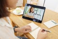 Asian woman aged 30-35 years using tablet, watching lesson online course communicate by conference video call from home, e- Royalty Free Stock Photo