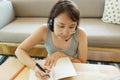 Asian woman aged 30-35 years using tablet, watching lesson online course communicate by conference video call from home, e- Royalty Free Stock Photo