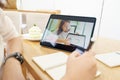 Asian woman aged 30-35 years using tablet, watching lesson online course communicate by conference video call from home, e- Royalty Free Stock Photo