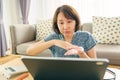 Asian woman aged 30-35 years using tablet, watching lesson Sign language online course communicate by conference video call from Royalty Free Stock Photo