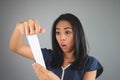 Asian woman amaze with the bill. Royalty Free Stock Photo