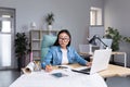 An asian woman architect designer wearing glasses working at desktop computer, working on project Royalty Free Stock Photo