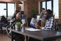 Asian woman arrived for interview sitting at desk in office while talking with business company recruiter about job Royalty Free Stock Photo