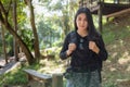 Asian woman backpack taking a photo with mirrorless camera Royalty Free Stock Photo