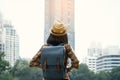 Asian woman backpacking starting traveling in city background