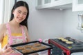 Asian woman Bake a cookies woman by oven