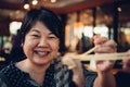 Asian woman in barbeque yakiniku grill restaurant Royalty Free Stock Photo