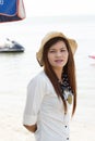 Asian woman in beautiful hat on tropical beach Royalty Free Stock Photo