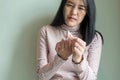 Asian woman with beriberi on hand or finger,Disease causing inflammation of the nerves