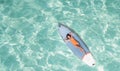 Asian woman in bikini sleep and relax on paddle board on the beach Royalty Free Stock Photo