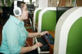 Asian woman with blindness disability using computer with refreshable braille display or braille terminal a technology assistive Royalty Free Stock Photo