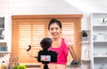 Asian woman blogger recording a video tutorial how to lose weight and get healthy. Influencer lifestyle concept