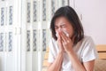 Asian woman blowing her nose while sitting on bed. illness woman Royalty Free Stock Photo