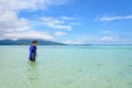 Asian woman walking in the sea at travel to Koh Lipe island Royalty Free Stock Photo