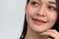 Asian woman braces. Teeth braces on the white teeth of women to equalize the teeth. Bracket system in smiling mouth, close up Royalty Free Stock Photo