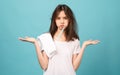 Asian woman brushing teeth and towel on the shoulder on blue background, Concept oral hygiene and health care Royalty Free Stock Photo