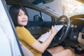 Asian woman business sitting in car and making note or working Royalty Free Stock Photo