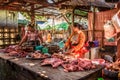 Asian woman butcher sells meat