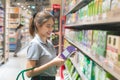 Asian Woman buying products in food supermarket Royalty Free Stock Photo