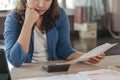 Asian woman calculating monthly expense and credit card debt Royalty Free Stock Photo