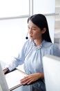 Asian woman is call center or secretary operator is talking with headset and a microphone for consultant to customers. Technician Royalty Free Stock Photo