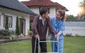 Asian woman caregiver helping senior man walking. Nurse assisting he old man patient at nursing home. Senior man using Royalty Free Stock Photo