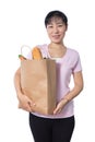 Asian Woman carrying shopping bag with groceries Royalty Free Stock Photo