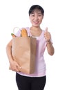 Asian Woman carrying shopping bag with groceries Royalty Free Stock Photo