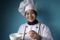 Asian Woman Chef Making Soup, Chef Tasting Soup From White Bowl Royalty Free Stock Photo