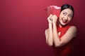 Asian woman in cheongsam dress holding angpao Royalty Free Stock Photo