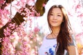 Asian Woman with Cherry Blossom or Sakura. Smiling Happy Girl