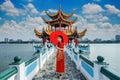 Asian woman in chinese dress traditional walking at Kaohsiung`s famous tourist attractions in Taiwan. Royalty Free Stock Photo