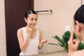 Asian woman cleaning face skin enjoy herself with bubble cleansing foam. Royalty Free Stock Photo