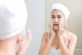 Asian woman cleaning face skin enjoy herself with bubble cleansing foam. Royalty Free Stock Photo