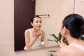 Asian woman cleaning face skin enjoy herself with bubble cleansing foam. Royalty Free Stock Photo