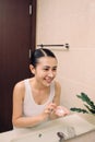 Asian woman cleaning face skin enjoy herself with bubble cleansing foam. Royalty Free Stock Photo