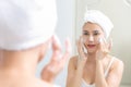 Asian woman cleaning face skin enjoy herself with bubble cleansing foam. Royalty Free Stock Photo